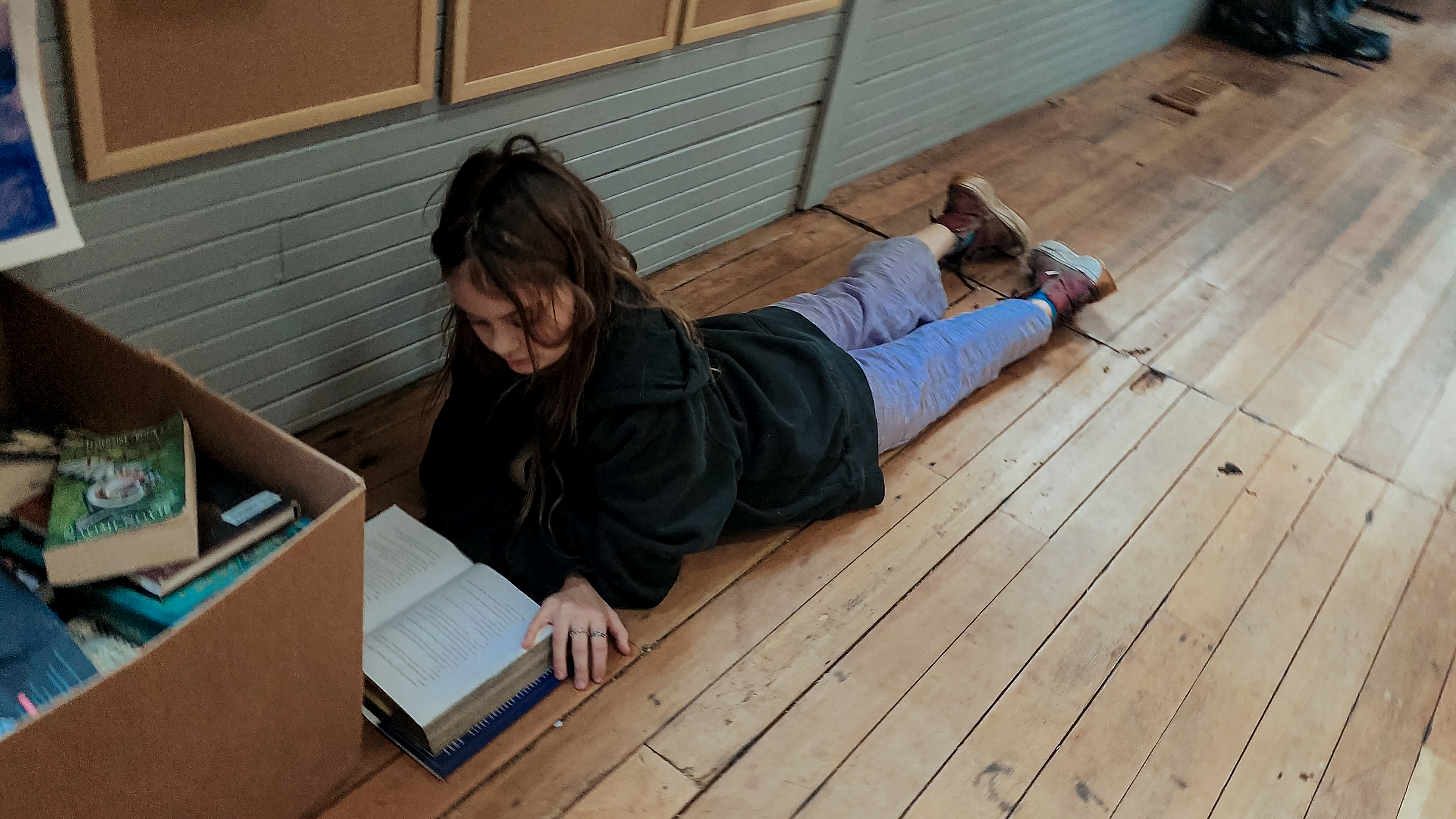 Learner Reading on Floor - Forge: An Acton Academy Private School in Newberg, Oregon